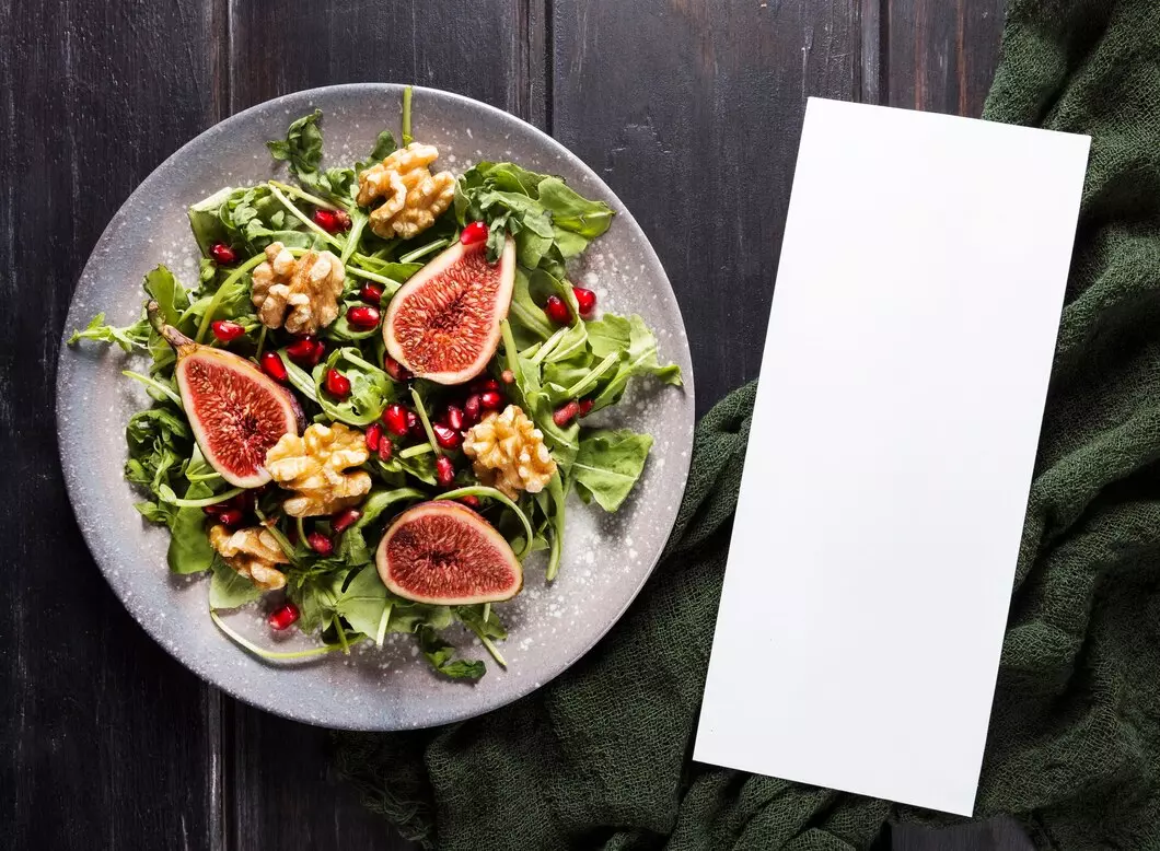 top-view-plate-with-fig-salad_23-2148684122